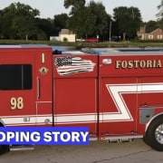 Fostoria News Fostoria Fire Division fire truck with developing story banner.